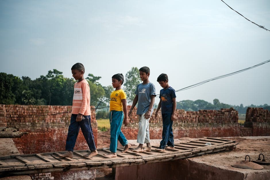 Children learning balance on beam