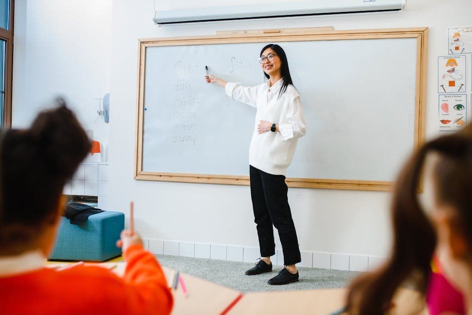 Teacher and children in an engaging classroom discussion